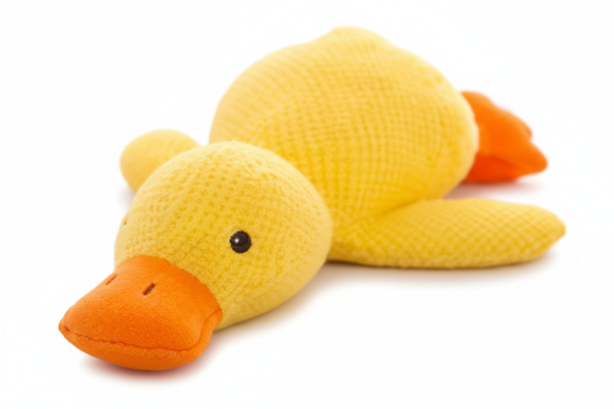 Yellow duck plush toy on a white background